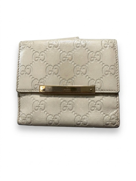 Gucci Handbags - Gucci Cream Embossed GG Leather Wallet with Gold Bar